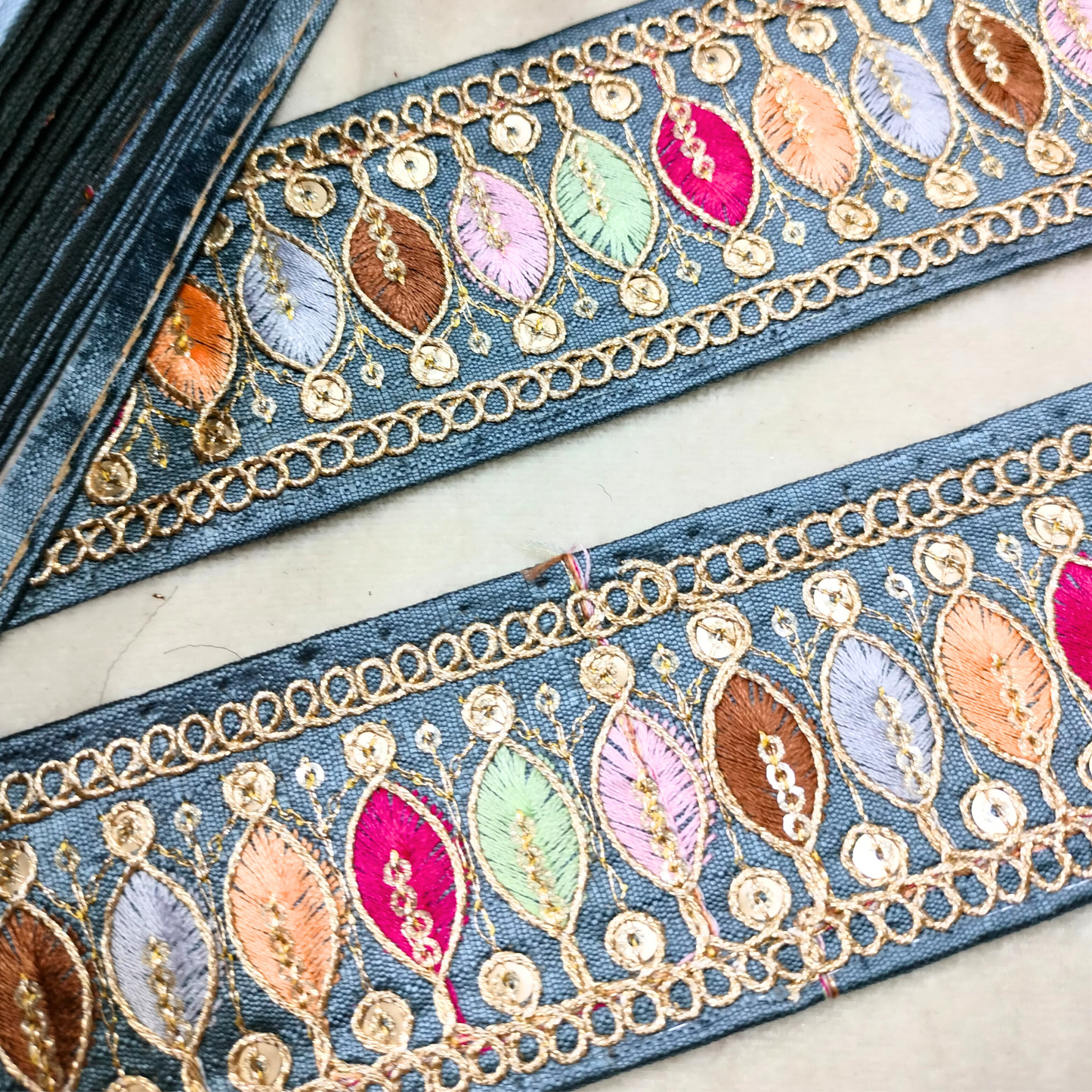 Elegant Grey Trim with Multicolor Thread Embellishments