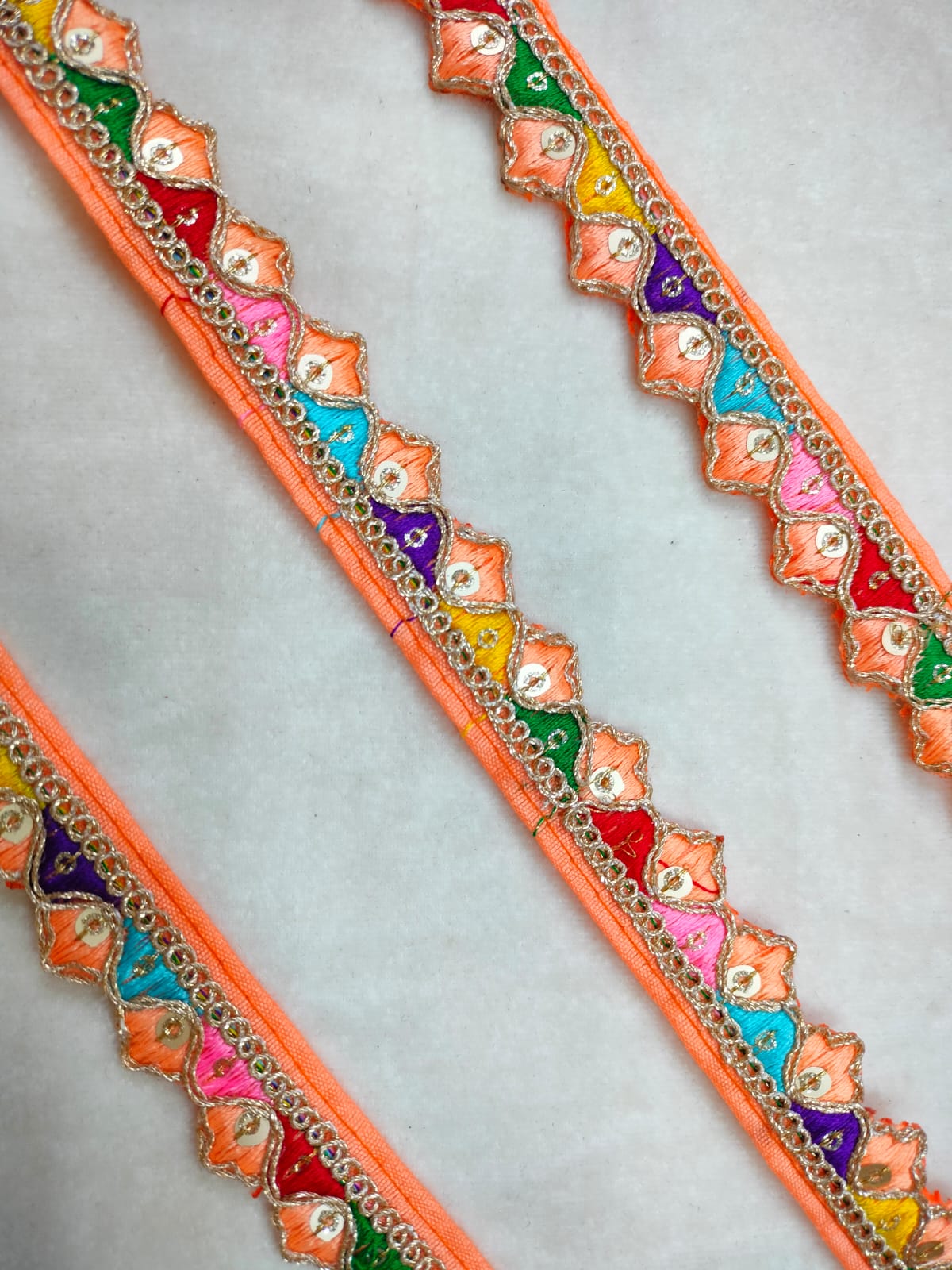 Elegant Peach Trim with Vibrant Multicolor Embroidery